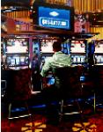 Las Vegas Slot Machines- stores and interiors- hyperrealism  painting of man hitting the slot machines in Las Vegas hotel lobby by artist Gerard Boersma