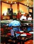 Sushi Bar- hyperrealism acrylic painting by artist painter Gerard Boersma showing a man in a sushi bar